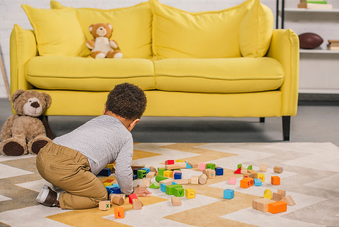 a boy playing with blocks