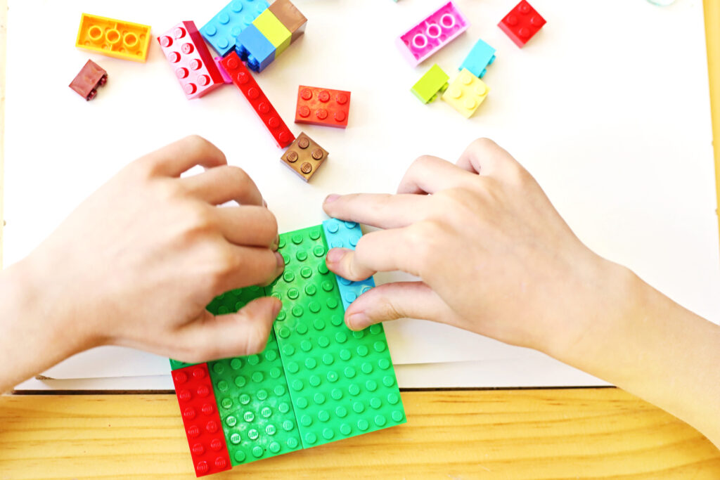 Build a Boat 1 - Cultivating Brilliant Minds building the boat out of legos