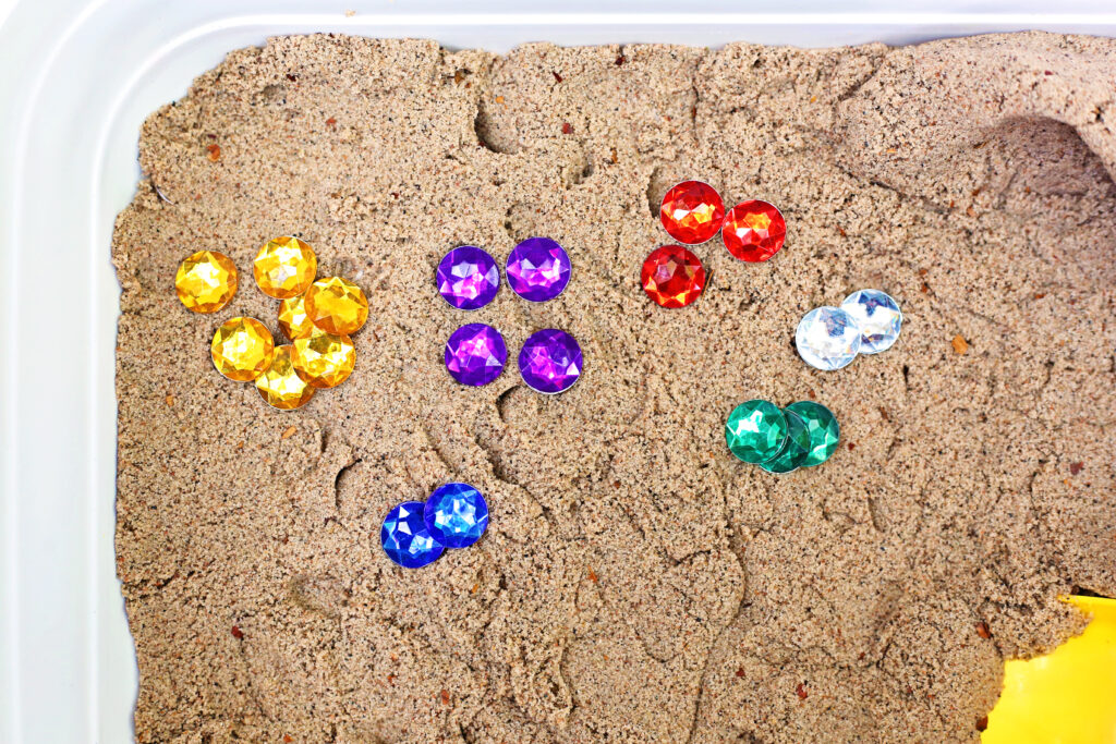Dragon_s Lair Sensory Bin 6 - Cultivating Brilliant Minds Dragon's Lair Sensory Bin Sand and gems