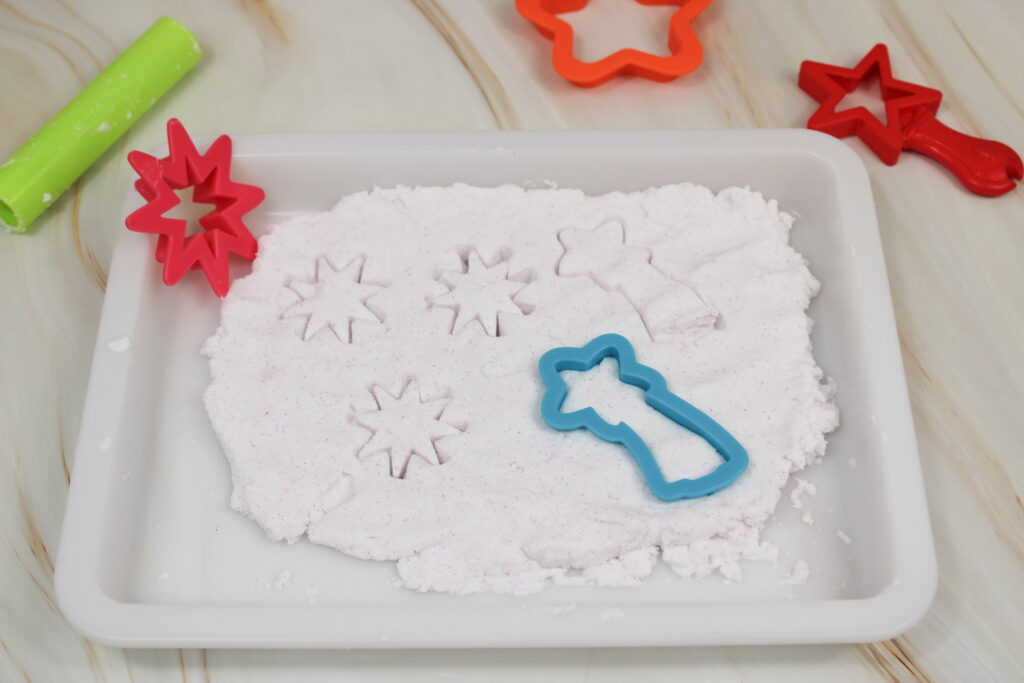 IMG_0044 - Cultivating Brilliant Minds using cookie cutters to cut out shapes from the glitter cloud dough