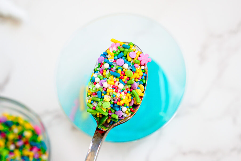 peeps pudding cups shared process-22 - Cultivating Brilliant Minds adding sprinkles on top of the first layer