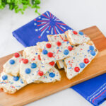 Fourth of July Crack Candy - Cultivating Brilliant Minds crackers with icing and red and blue m&ms