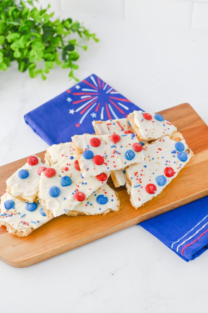 Fourth of July Crack Candy - Cultivating Brilliant Minds crackers with white chocolate and red and blue m&ms