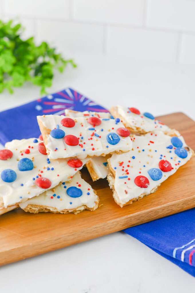 Fourth of July Crack Candy - Cultivating Brilliant Minds crackers with white chocolate and red and blue m&ms