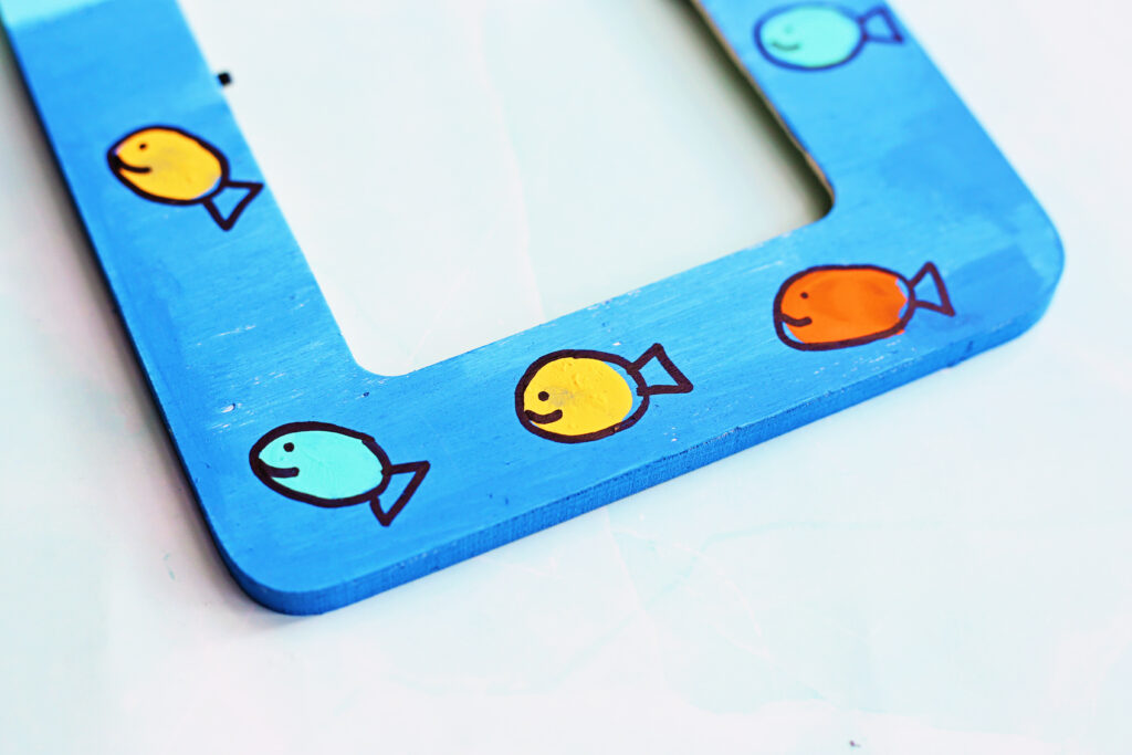 Draw Fish Outlines Around Fingerprint - Cultivating Brilliant Minds adding details