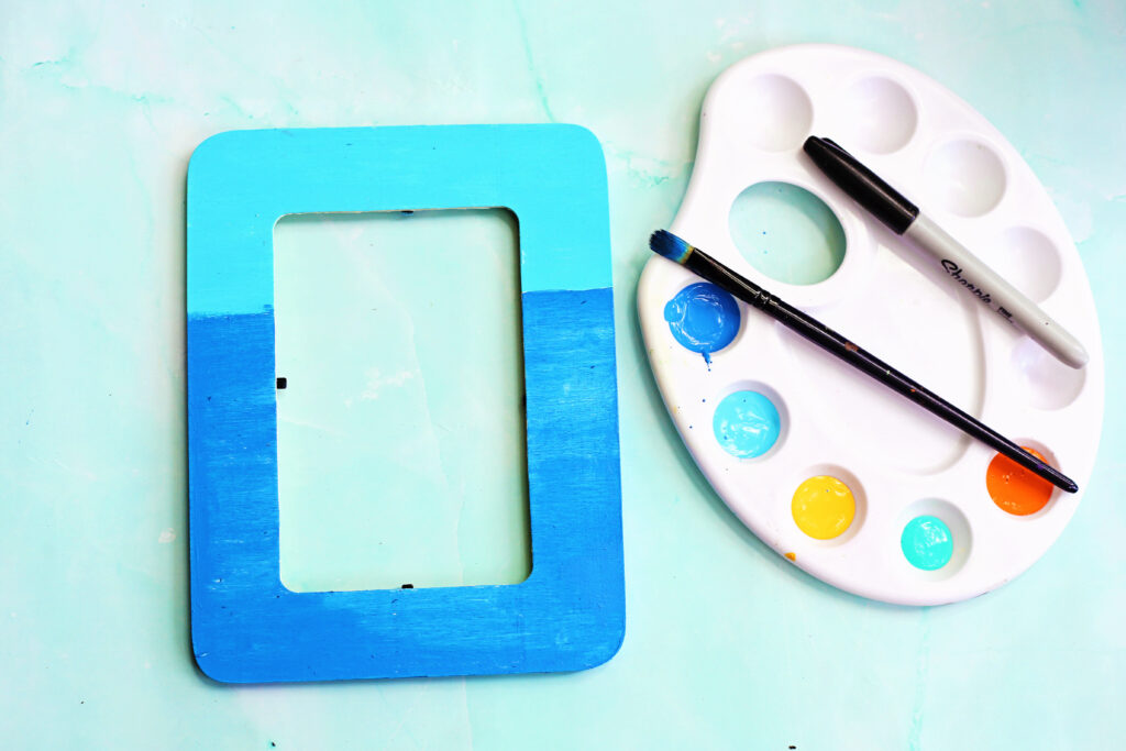 Paint Bottom Dark Blue - Cultivating Brilliant Minds painting the background