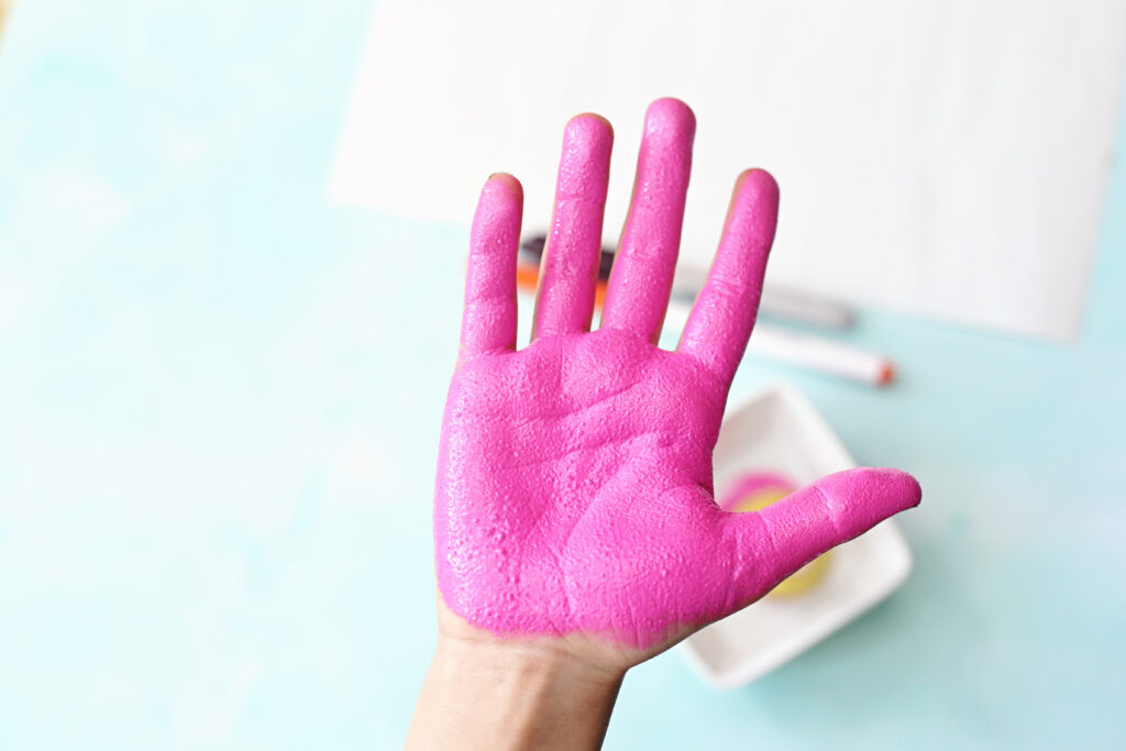 Paint Hand - Cultivating Brilliant Minds painting hand