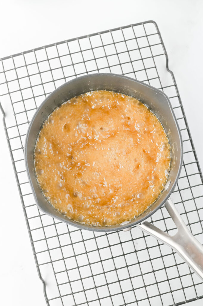 Fourth of July Crack Candy - Cultivating Brilliant Minds butter and sugar heated in a pan