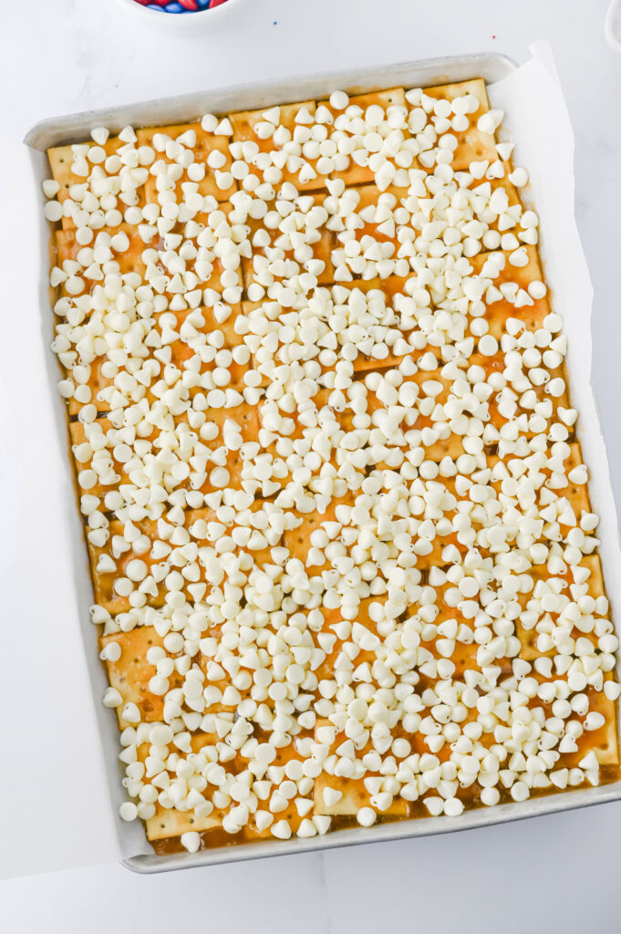 Fourth of July Crack Candy - Cultivating Brilliant Minds saltines covered in butter and sugar and white chocolate chips