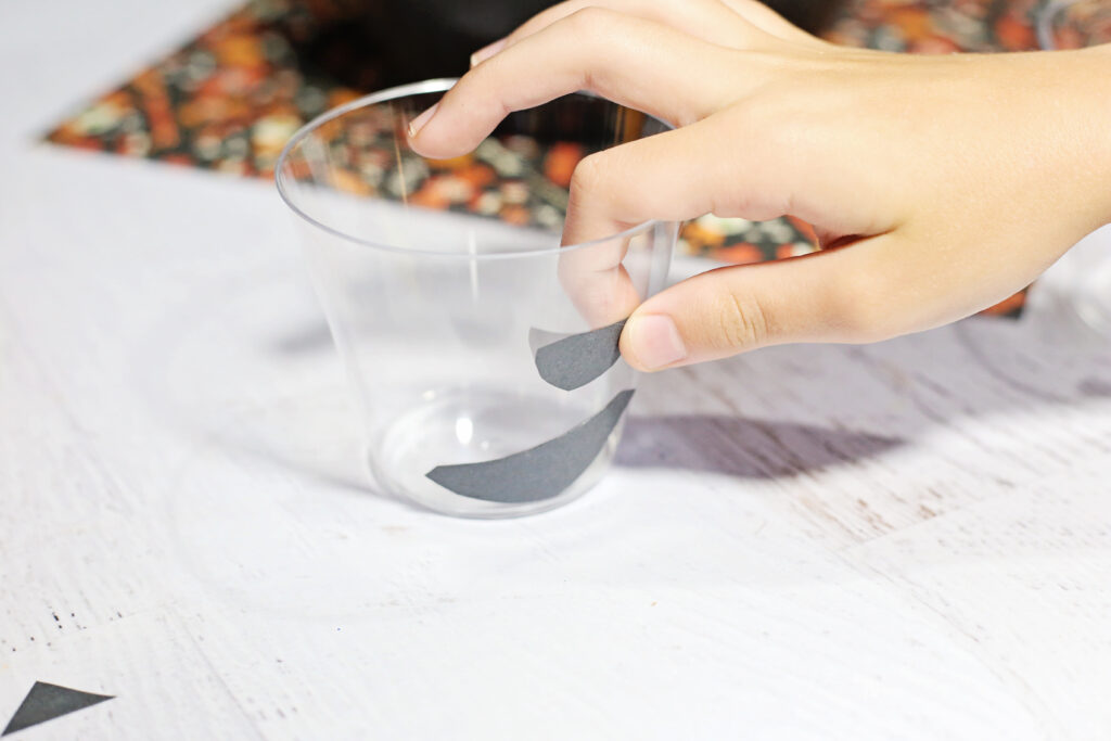 Child Gluing Shapes - Cultivating Brilliant Minds Child Gluing Shapes