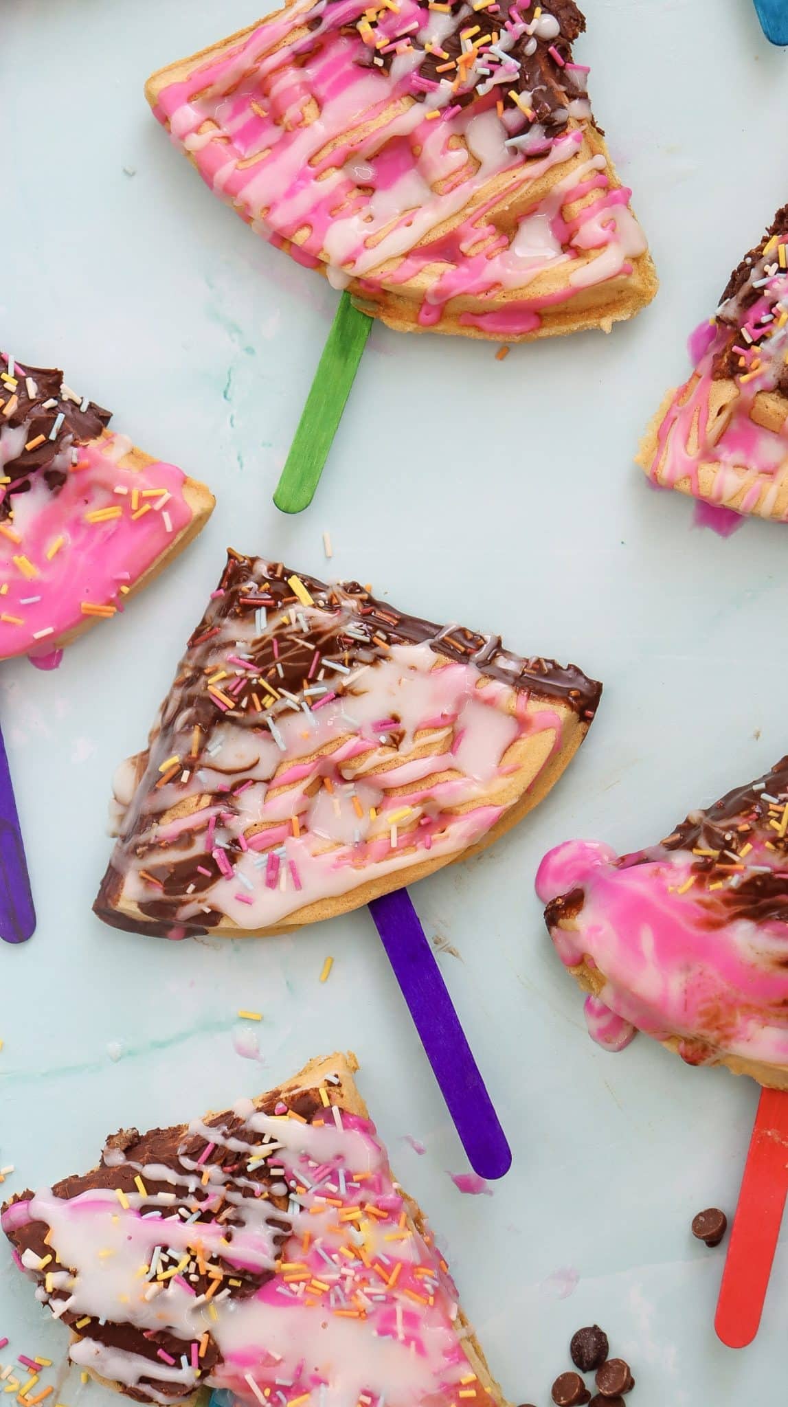 waffle pops dipped in chocolate with sprinkles on top