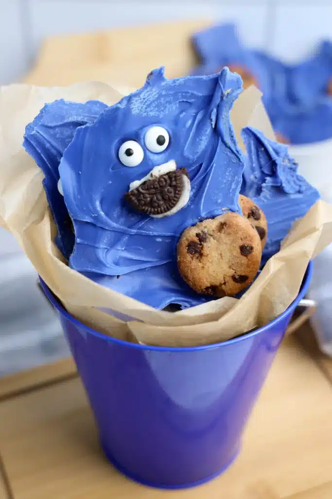 Cookie Monster Bark - Cultivating Brilliant Minds chocolate bark dyed blue with cookies and a face to look like the cookie monster