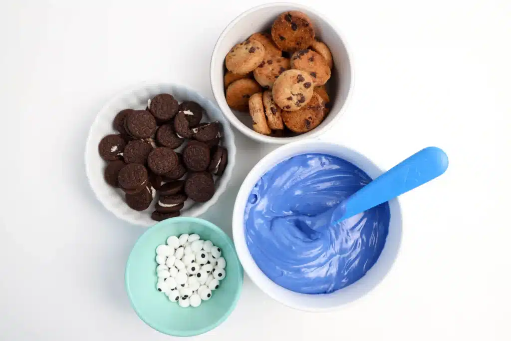 Cookie Monster Bark - Cultivating Brilliant Minds oreos, mini cookies, candy eyes, and blue candy chocolate melts