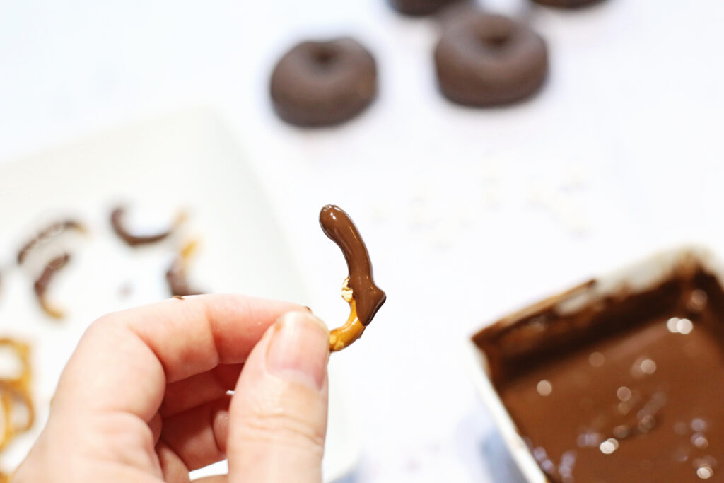 Dip Pretzel Legs into Chocolate - Cultivating Brilliant Minds spider donuts recipe