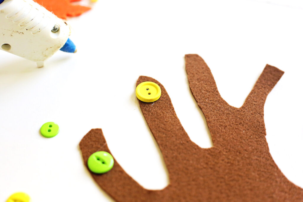 Glue Buttons to Tree Trunk - Cultivating Brilliant Minds Glue Buttons to Tree Trunk