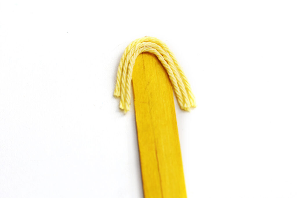 Glue Yarn to Popsicle Stick - Cultivating Brilliant Minds add the fairy's hair for this easy fall craft