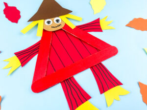 fall scarecrow craft made of popsicle sticks and construction paper