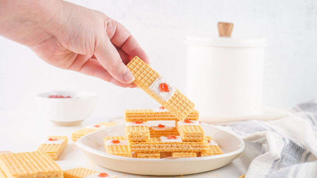 bandaid cookies-01 - Cultivating Brilliant Minds a hand holding up a band-aid cookie