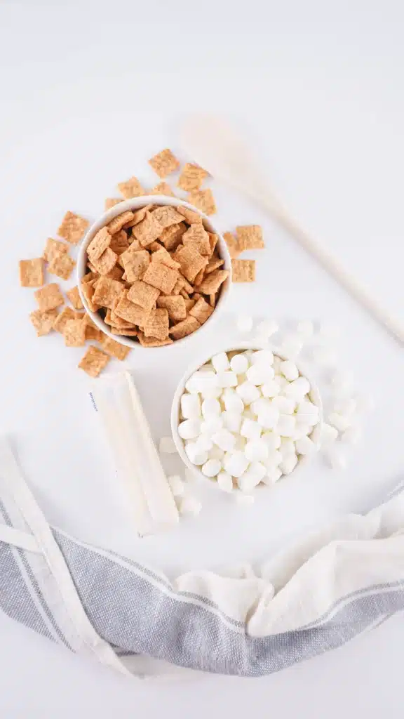 Cinnamon Toast Crunch Treats - Cultivating Brilliant Minds cinnamon toast crunch, marshmallows, butter, and a wooden spoon