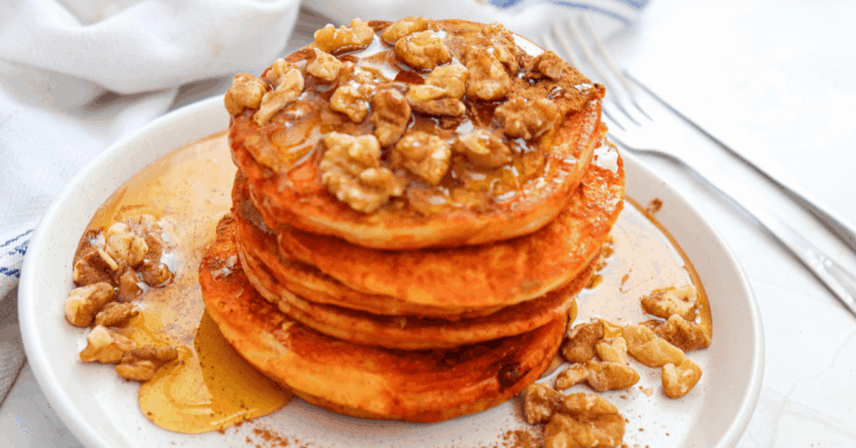 pumpkin pancakes stacked on a plate