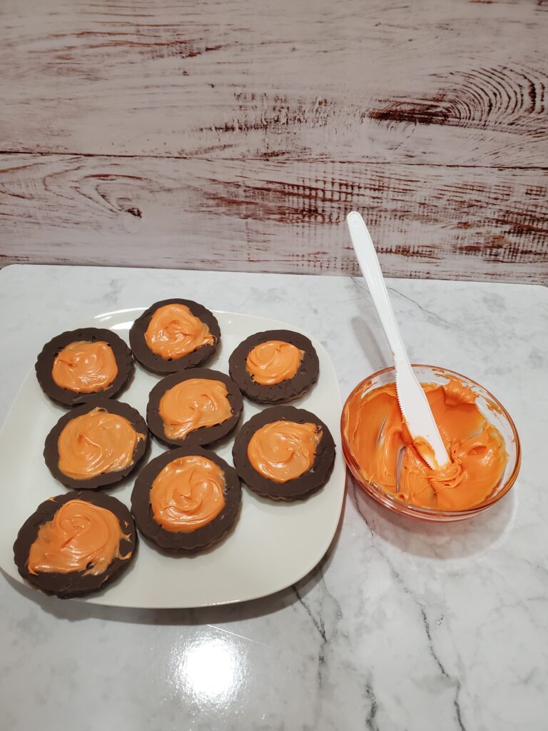 Copy of 20230924_101743 - Cultivating Brilliant Minds striped cookies with orange icing on them