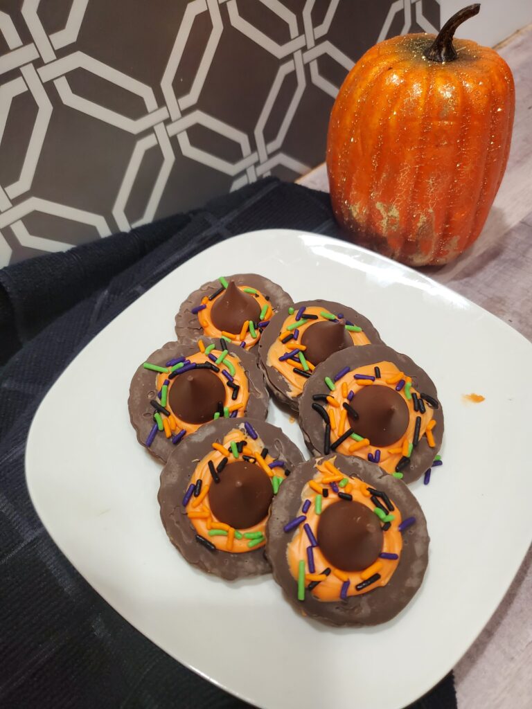 Copy of 20230927_221847 - Cultivating Brilliant Minds chocolate witch hats on a white plate