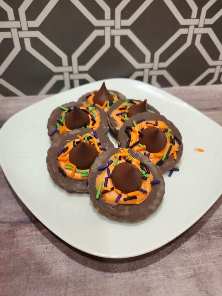 Copy of 20230927_221909 - Cultivating Brilliant Minds chocolate witch hats on a white plate