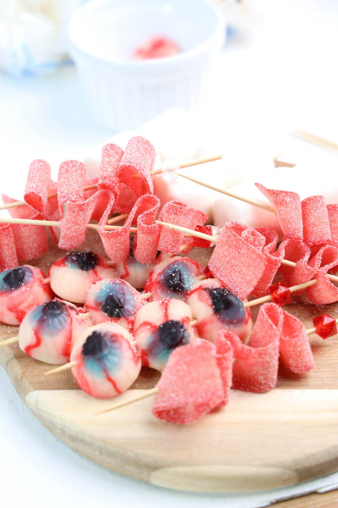 Eyeball Candy Cups - Cultivating Brilliant Minds Eyeball Candies and long gummy strips on skewers