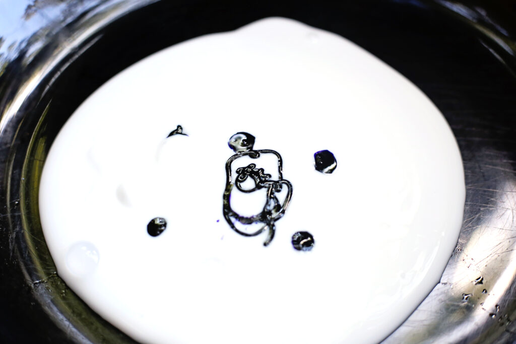 Glue and Food Coloring - Cultivating Brilliant Minds Mix glue and black food coloring