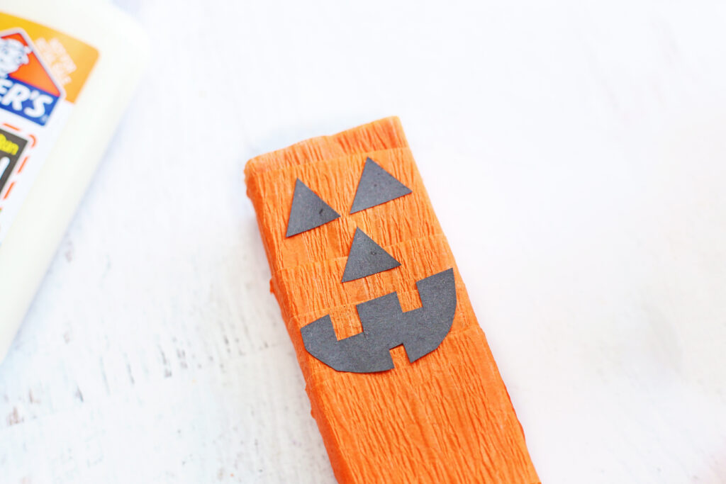 Glue jack o lantern face - Cultivating Brilliant Minds Halloween drink for kids