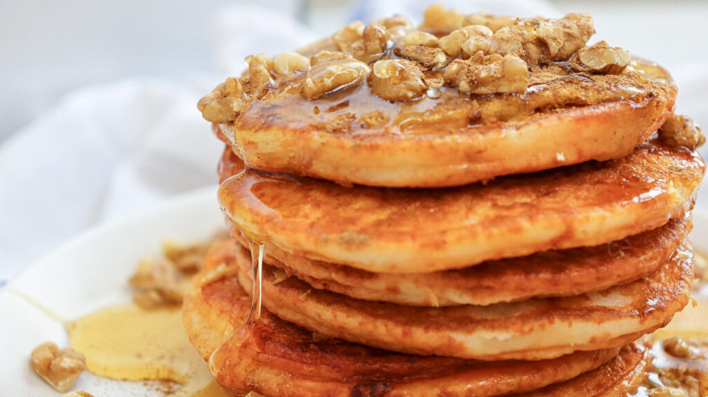 Pumpkin Pancakes - Cultivating Brilliant Minds a stack of pumpkin pancakes