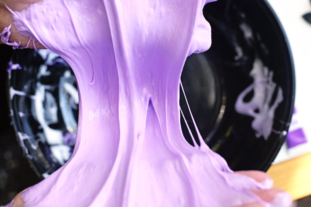 Knead Slime - Cultivating Brilliant Minds kneading the bowtie pasta bat slime