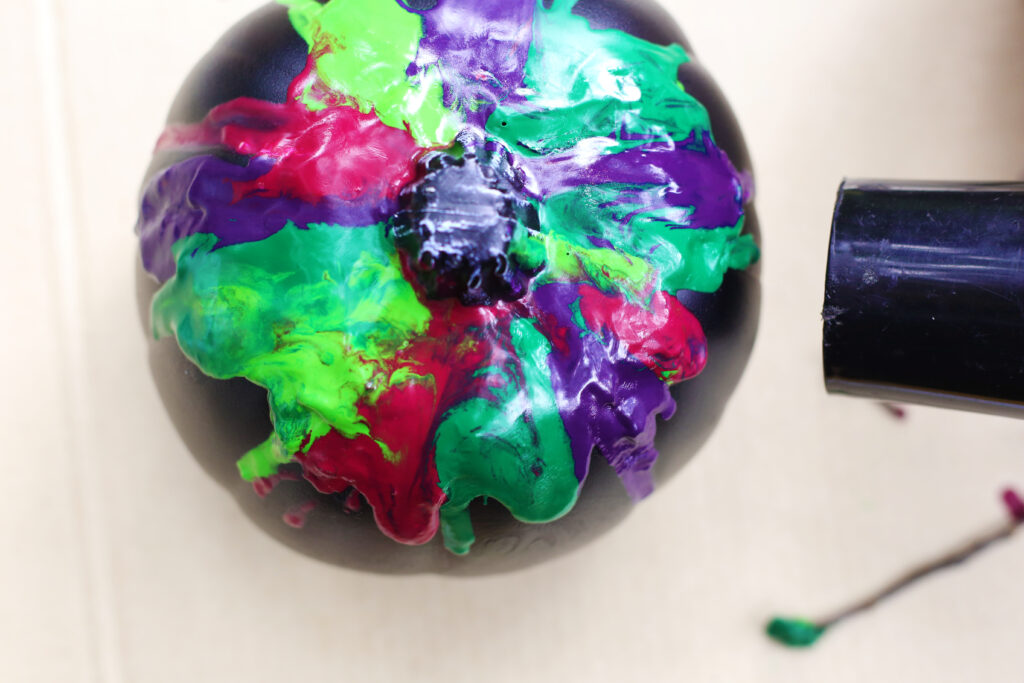 Melted crayons - Cultivating Brilliant Minds the black pumpkin with glued crayons to the top and a hair dryer