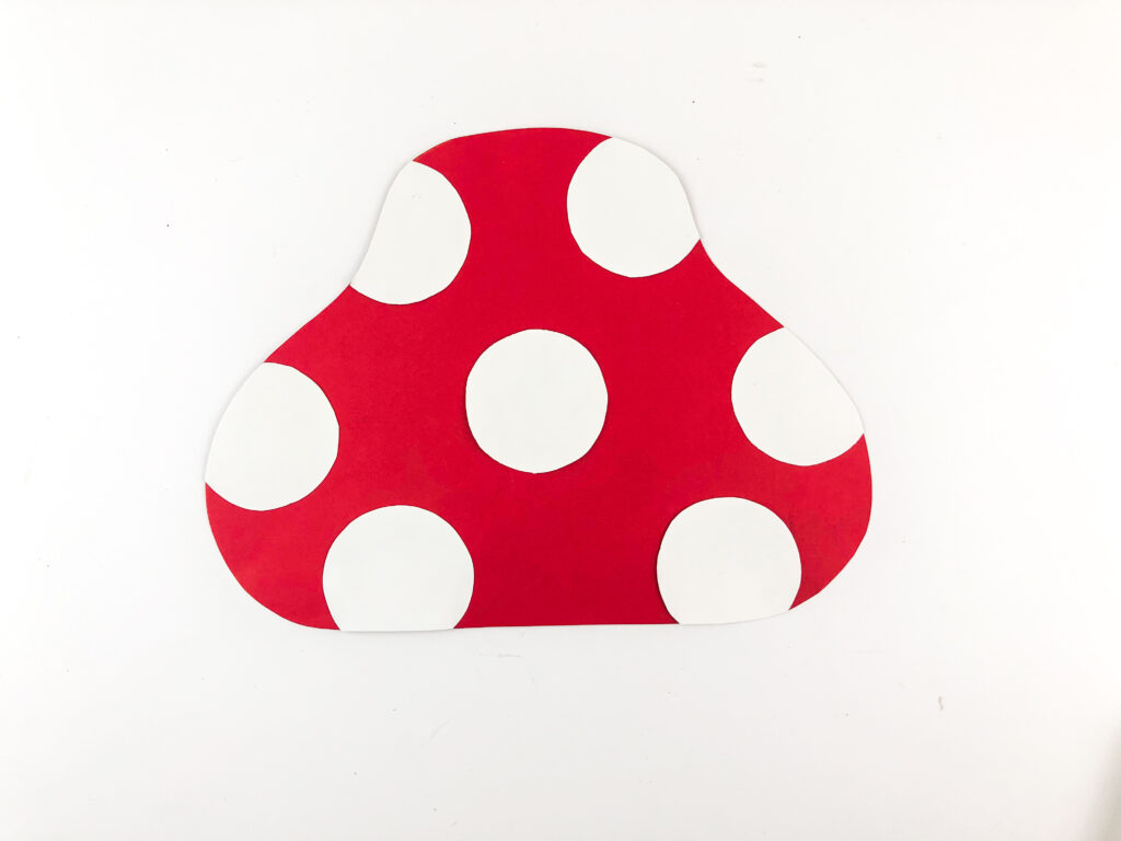 Photo 7-16-25 7 54 11 PM - Cultivating Brilliant Minds glueing white circles on the mushroom cap