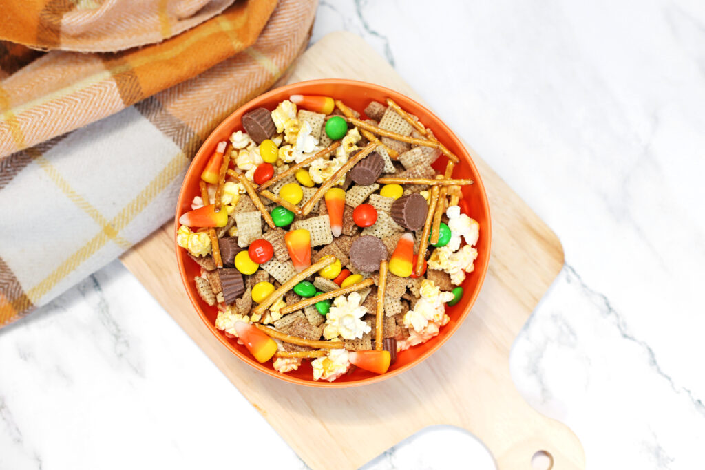 Scarecrow Snack Mix Recipe Final 1 - Cultivating Brilliant Minds scarecrow snack mix in an orange bowl