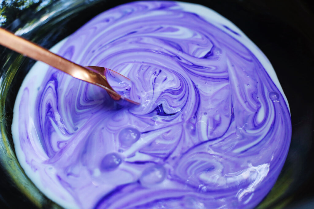 Stir Glue and Food Coloring - Cultivating Brilliant Minds Mixing the glue and food coloring