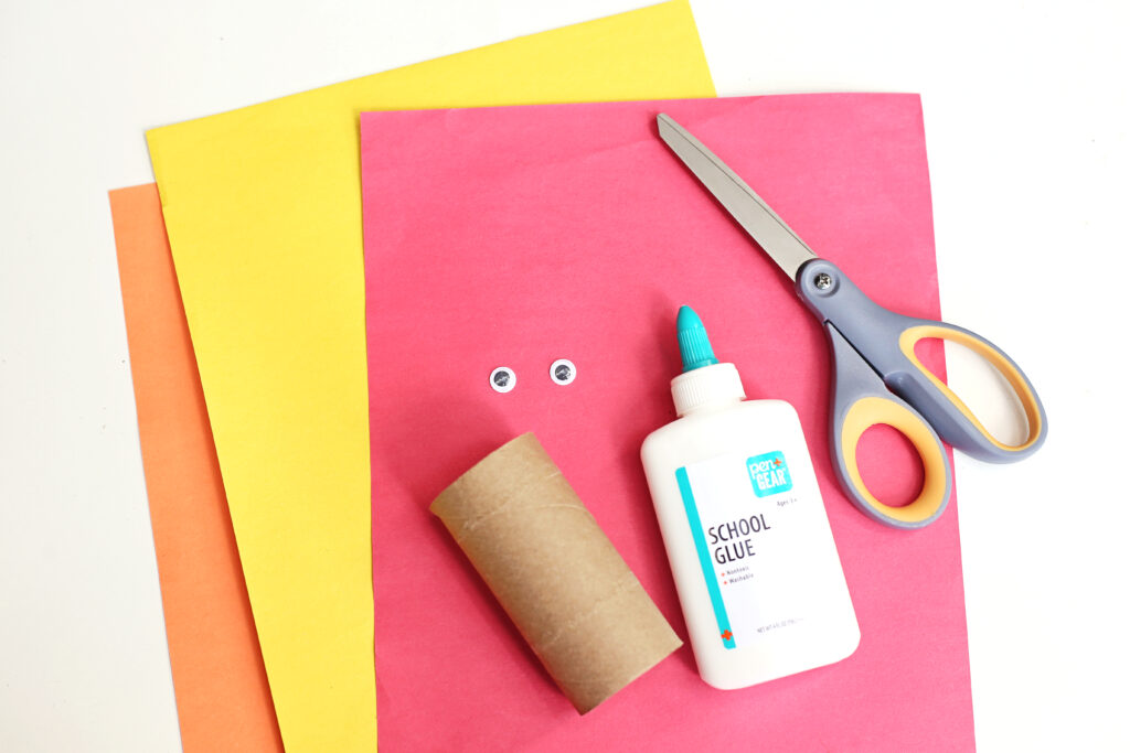 Toilet Paper Roll Turkey Supplies - Cultivating Brilliant Minds supplies for the Turkey craft for kids including construction paper, scissors, google eyes, glue, and a toilet paper roll