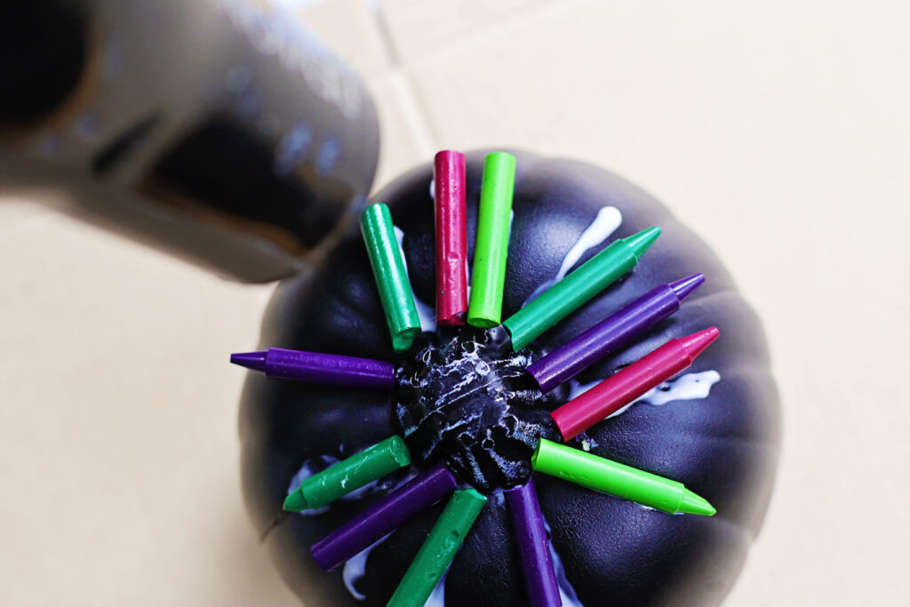 Use blowdryer - Cultivating Brilliant Minds the black pumpkin with glued crayons to the top and a hairdryer