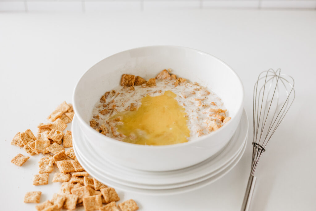 cinnamon toast crunch donuts-40 - Cultivating Brilliant Minds dry and wet ingredients in a bowl