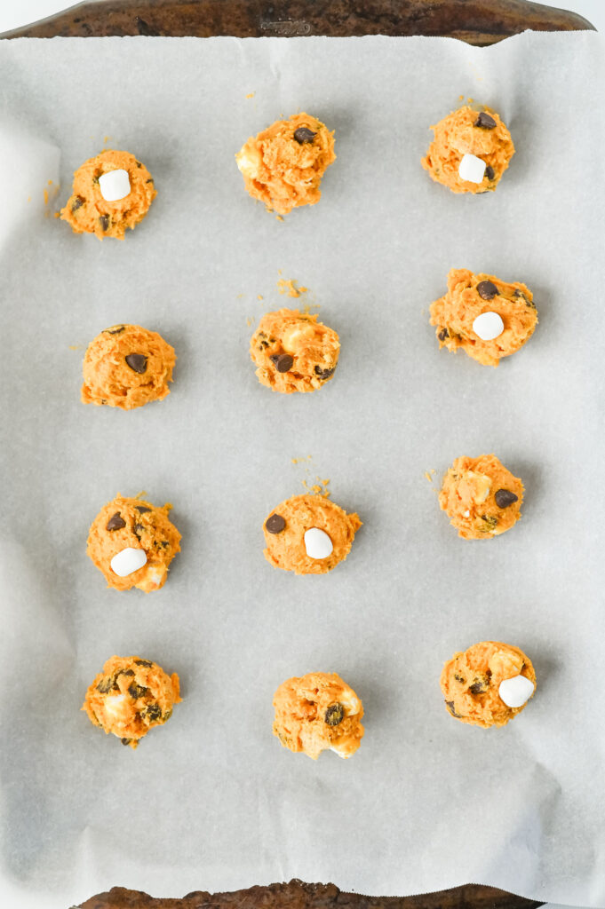 pumpkin s'mores cookies - Cultivating Brilliant Minds pumpkin s'mores cookie mix in balls on parchment paper