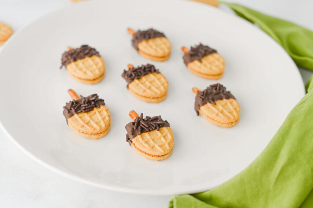 Nutter Butter Acorns - Cultivating Brilliant Minds Nutter Butter Acorns on a white plate