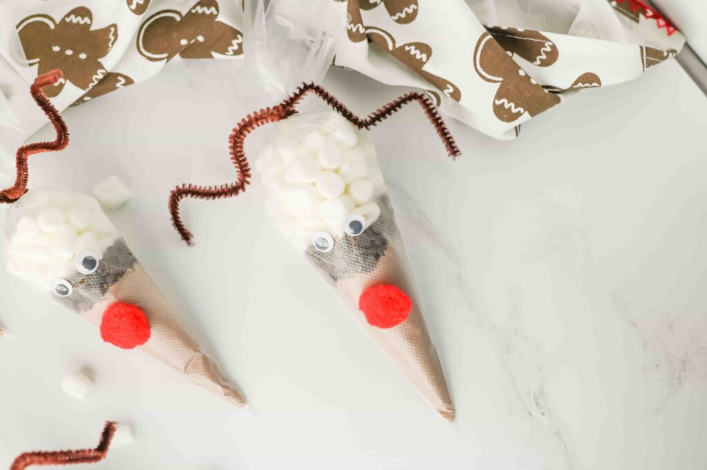 Reindeer Hot Chocolate - Cultivating Brilliant Minds hot chocolate mix in a plastic piping bag decorated to look like a reindeer
