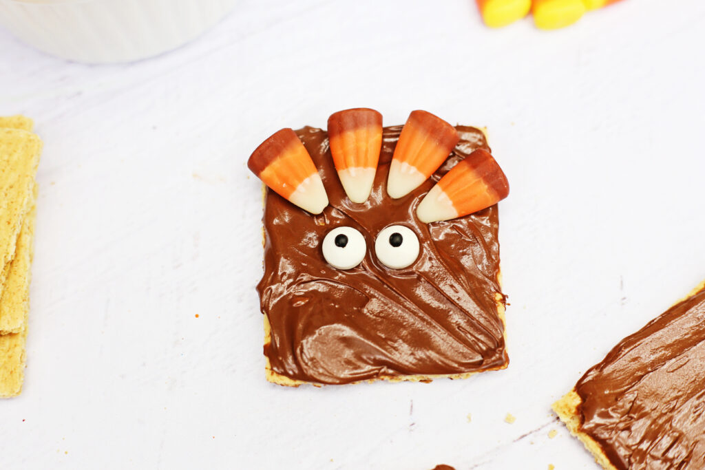 Graham Cracker Turkey - Cultivating Brilliant Minds graham crackers with nutella ,candy corn, and candy eyes