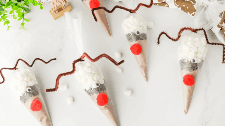 hot chocolate mix in a plastic piping bag decorated to look like a reindeer