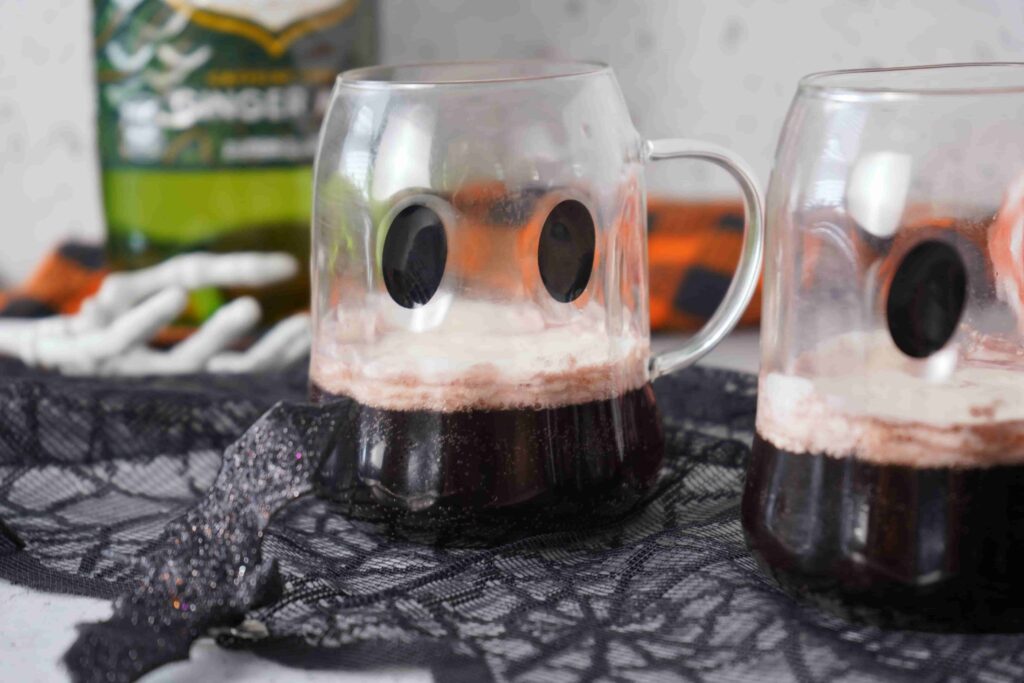 Black Halloween Punch For Kids - Cultivating Brilliant Minds Black halloween punch in a clear ghost mug