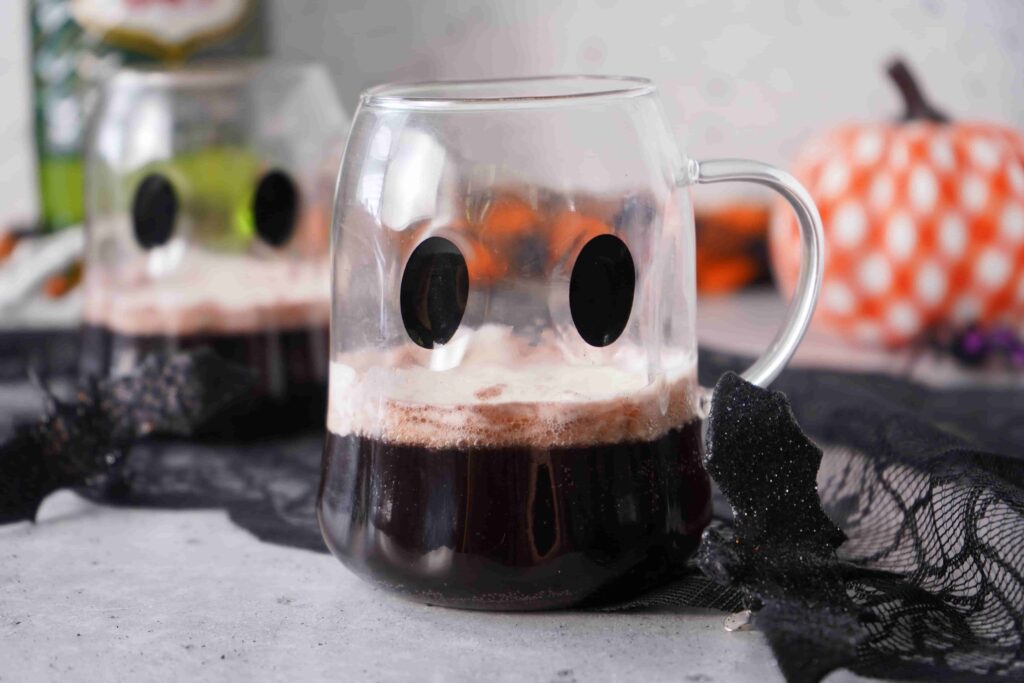 Black Halloween Punch For Kids - Cultivating Brilliant Minds Black halloween punch in a clear ghost mug