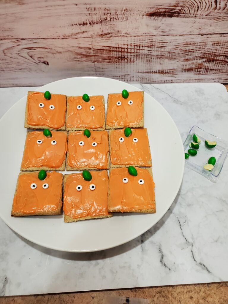 Spookley the Square Pumpkin Graham Crackers - Cultivating Brilliant Minds Add the eyes and stem to the cracker