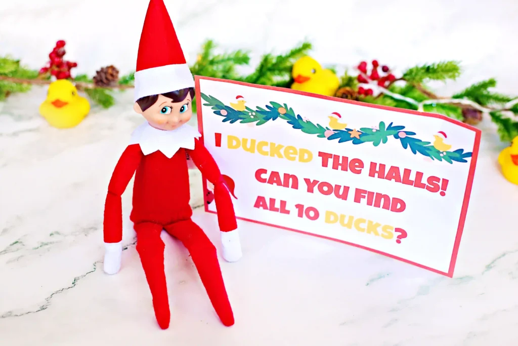 Elf on the Shelf Idea - Cultivating Brilliant Minds an elf on the shelf next to a duck with a sign that reads "I ducked the halls! Can you find all 10 ducks?"