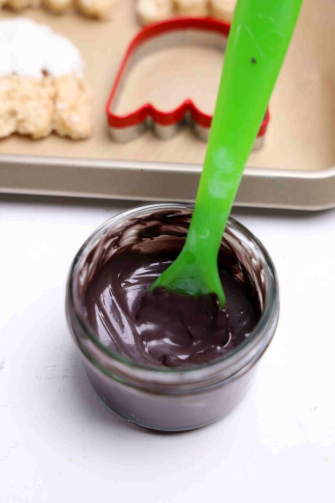 Ghost Rice Krispie Treats - Cultivating Brilliant Minds melted chocolate in a bowl