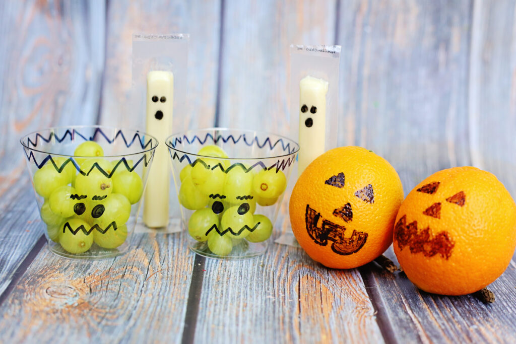 Healthy Halloween Snacks Final 1 - Cultivating Brilliant Minds Healthy Halloween Snacks - Grapes, string cheese, and oranges